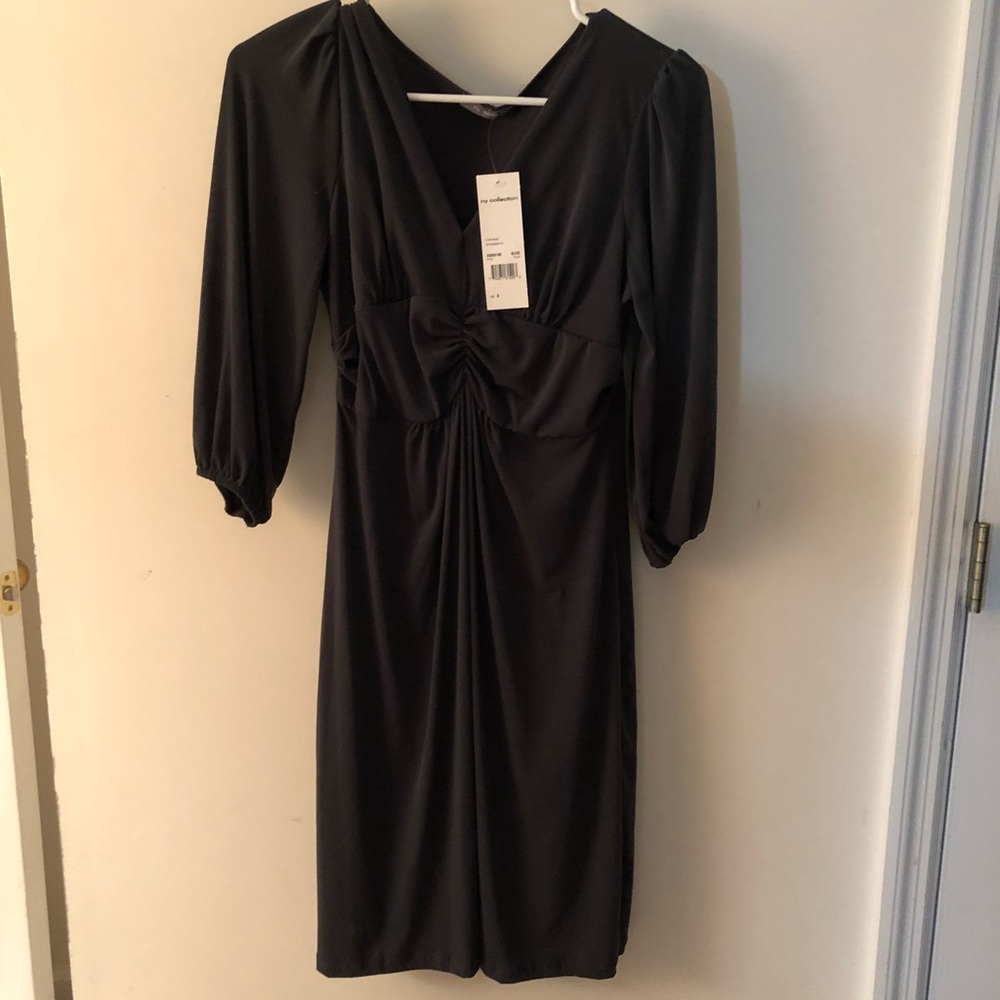 Macy’s knee length olive green dress.